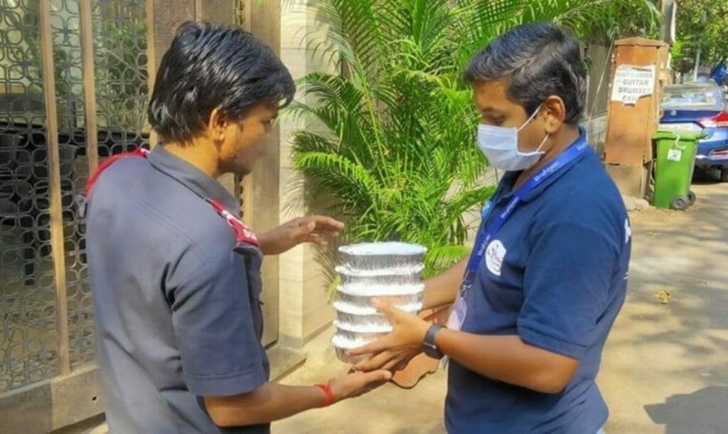 Roti Ghar volunteer delivering food packages