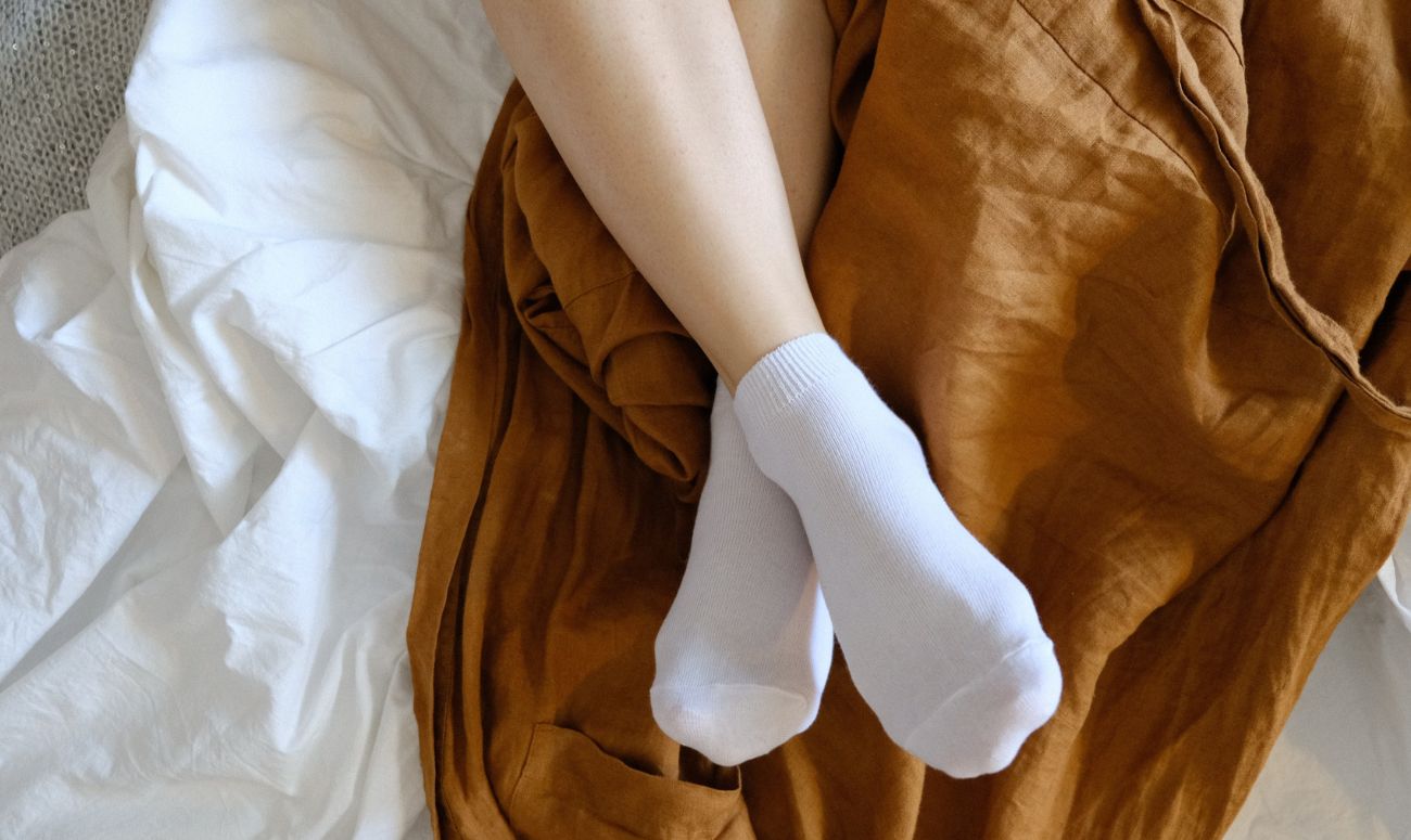 wearing-socks-to-bed-for-better-sleep-inside-image